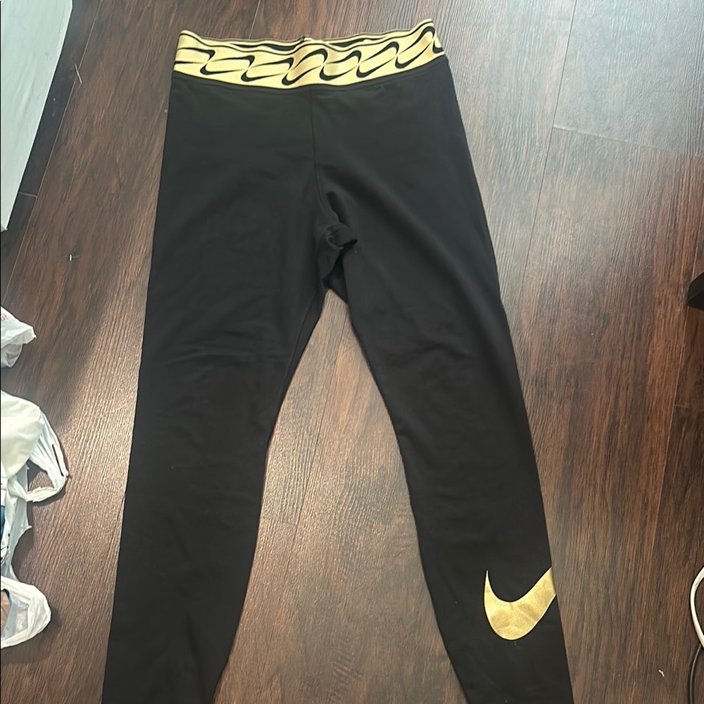 Nike Black and Gold Leggings Sleek Design